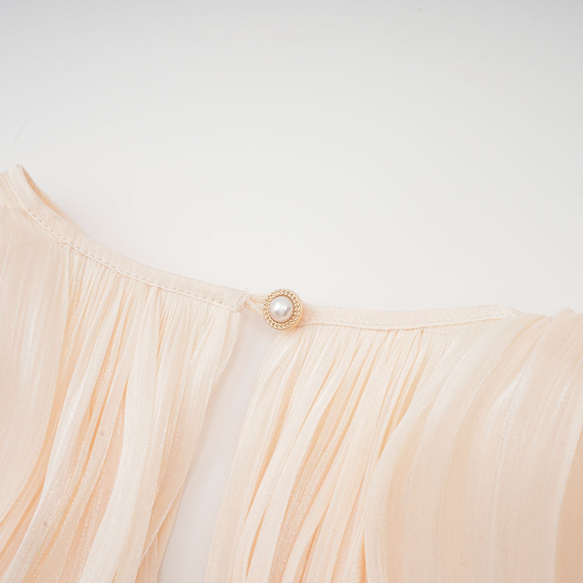 Céleste Ivory Pleated Mini Dress